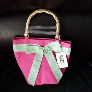 Adorable handbag with bamboo handles.